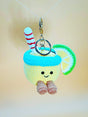 Keychain with a lemon character design on a plain background